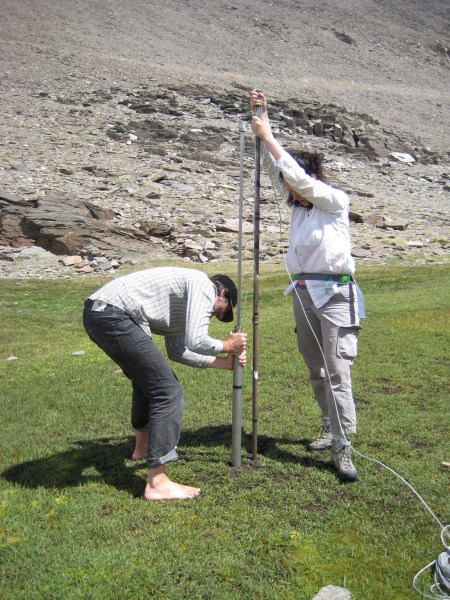 Two researchers conducting experiments in the Sierra Nevada mountain range