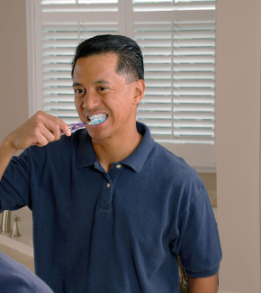 A man brushing his teeth