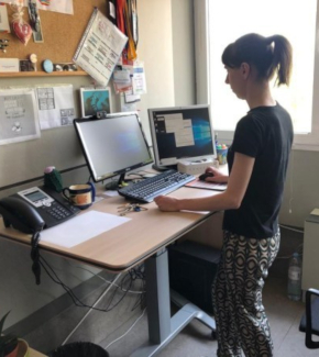 A researchers completing task while standing at a desk