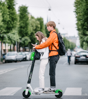 Two young people on an electric scooter