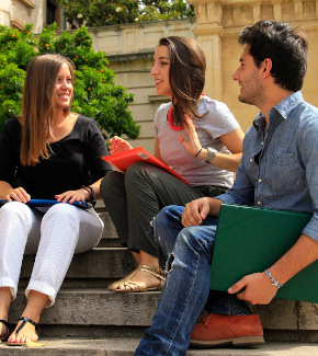 Students sitting outside chatting