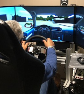 A man using a driving simulator