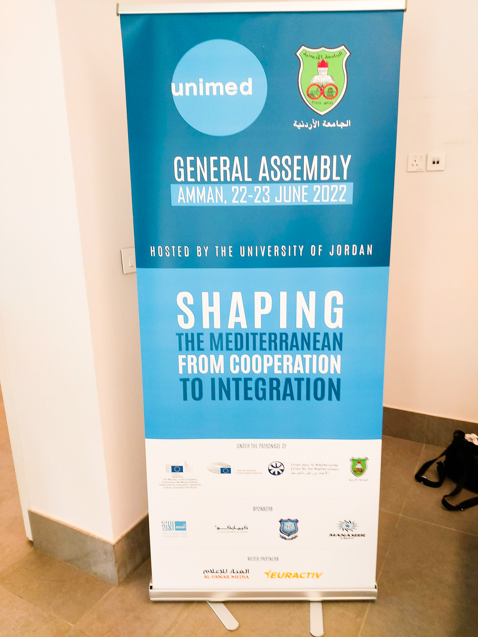 Foto del cartel de la Asamblea General de UNIMED 2022 