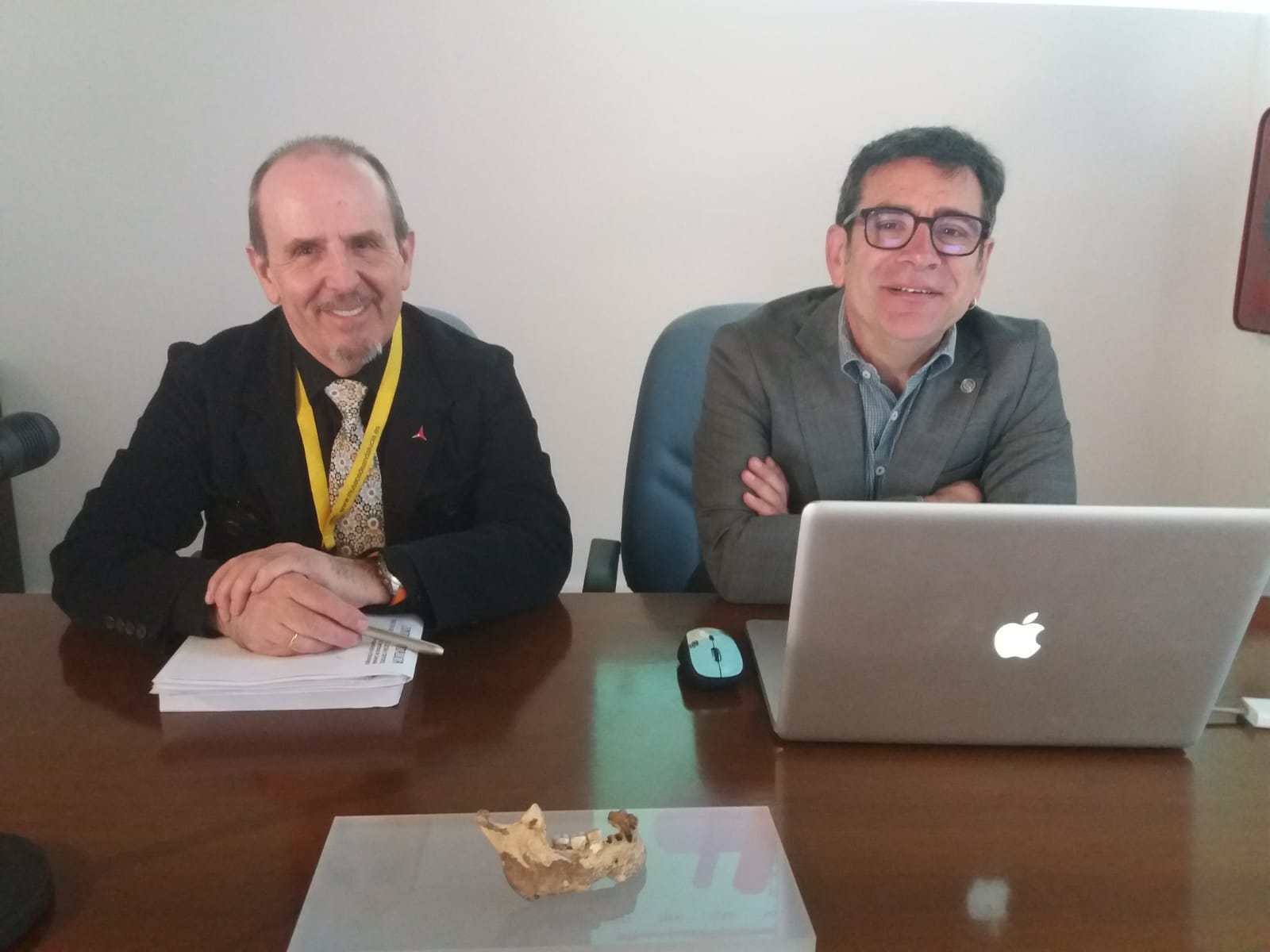 Two researchers sitting together at a table