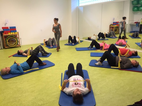 A group of women completing exercises