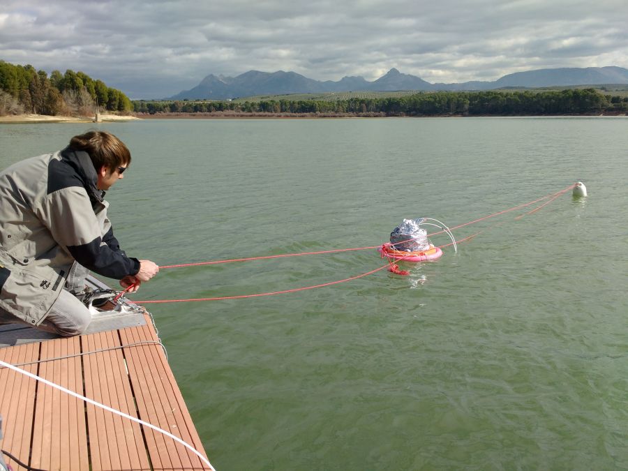 A researcher conducting experiments at a reservoir