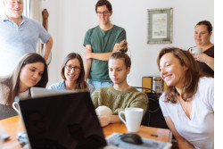 People looking at a laptop