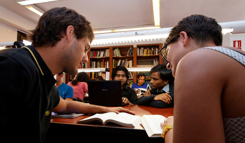 Several students in a library