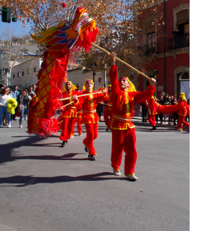 A dragon dance being held on the streets of Granada