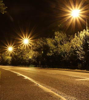 A main road illuminated at night