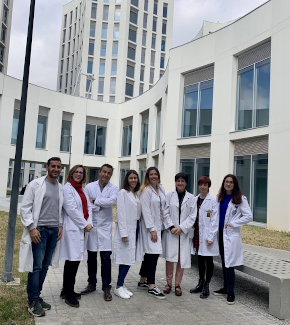 Researchers in front of a building