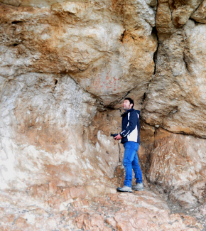 A researcher inside a cave